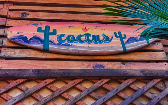 Advertising sign on surfboard surf board cactus beach club in Zicatela Puerto Escondido Oaxaca Mexico.