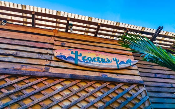 Advertising sign on surfboard surf board cactus beach club in Zicatela Puerto Escondido Oaxaca Mexico.