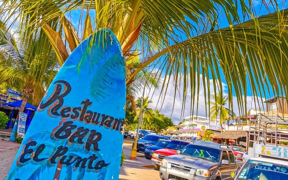 Advertising sign on surfboard surf board in Zicatela Puerto Escondido Oaxaca Mexico.