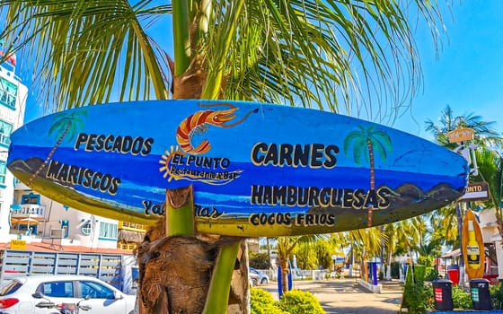 Advertising sign on surfboard surf board in Zicatela Puerto Escondido Oaxaca Mexico.