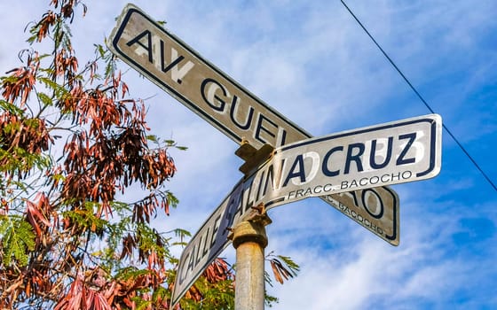 Blue and white road street signs and name for orientation of streets and roads in Zicatela Puerto Escondido Oaxaca Mexico.