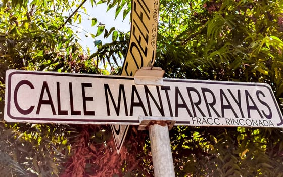 Blue and white road street signs and name for orientation of streets and roads in Zicatela Puerto Escondido Oaxaca Mexico.