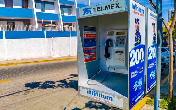 Old telephone box with handset and keypad in Zicatela Puerto Escondido Oaxaca Mexico.