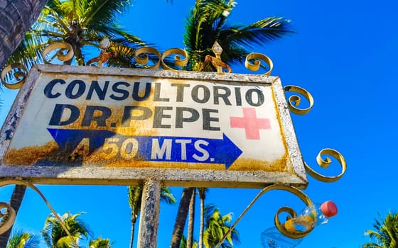 Blue and white road street signs and name for orientation of streets and roads in Zicatela Puerto Escondido Oaxaca Mexico.