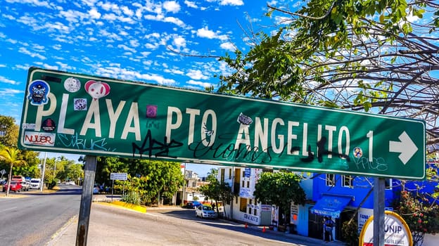 Green Playa Puerto Angelito Beach road street signs and name for orientation of streets and roads in Zicatela Puerto Escondido Oaxaca Mexico.