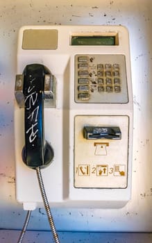 Old telephone box with handset and keypad in Zicatela Puerto Escondido Oaxaca Mexico.