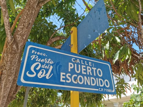 Blue and white road street signs and name for orientation of streets and roads in Zicatela Puerto Escondido Oaxaca Mexico.