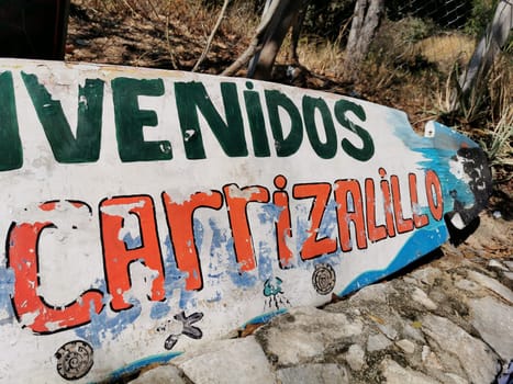 Advertising sign on surfboard surf board Beach Playa Carrizalillo in Zicatela Puerto Escondido Oaxaca Mexico.