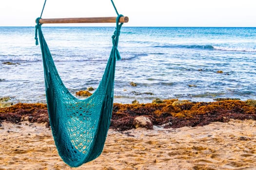 Hammock on a tropical paradisiacal beach in the Caribbean in Playa del Carmen Quintana Roo Mexico.