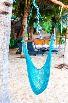 Hammock on a tropical paradisiacal beach in the Caribbean in Playa del Carmen Quintana Roo Mexico.