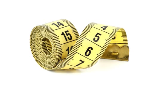 Spirals of yellow tape measure create a visual impression of motion, isolated white background
