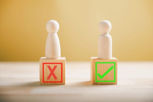 Wooden block choice, people indicate right and wrong considering yes or no. Business dilemma portrayed with true and false symbols on wood. Decision concept depicted. Think With Yes Or No Choice.