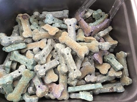 Bin of Multicolored Dog Cookies, Many Treats for Good Dogs. High quality photo