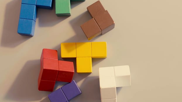 Close up of the colored on the table cubes top view. 3D tetris