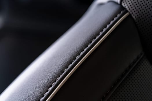 Denver, Colorado, USA-May 5, 2024-This image captures a detailed close-up view of the intricate stitching on a leather seat inside a Tesla Cybertruck, showcasing the high-quality materials and craftsmanship.