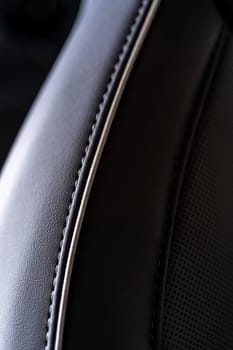 Denver, Colorado, USA-May 5, 2024-This image captures a detailed close-up view of the intricate stitching on a leather seat inside a Tesla Cybertruck, showcasing the high-quality materials and craftsmanship.