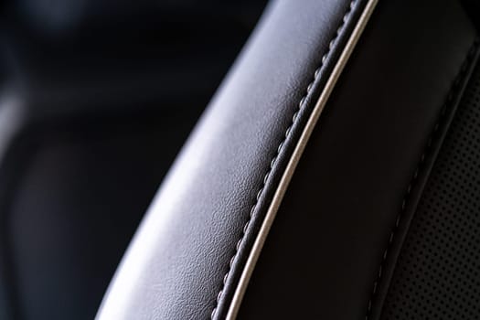 Denver, Colorado, USA-May 5, 2024-This image captures a detailed close-up view of the intricate stitching on a leather seat inside a Tesla Cybertruck, showcasing the high-quality materials and craftsmanship.