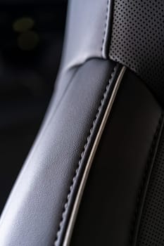 Denver, Colorado, USA-May 5, 2024-This image captures a detailed close-up view of the intricate stitching on a leather seat inside a Tesla Cybertruck, showcasing the high-quality materials and craftsmanship.