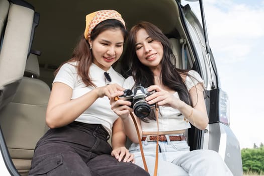 A young lesbian couple enjoyed driving out to see nature and taking picture together..