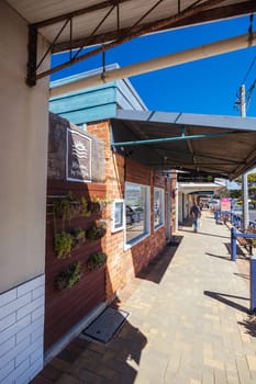 BERMAGUI, AUSTRALIA - April 3 2024: Bermagui Main St and shops in Bega Shire, New South Wales, Australia