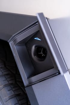 Denver, Colorado, USA-May 5, 2024-This image captures the charging port of the Tesla Cybertruck, showcasing the sleek and functional design that facilitates easy access for electric charging, emphasizing Tesla commitment to sustainable and innovative automotive solutions.