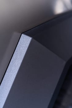 Denver, Colorado, USA-May 5, 2024-This image captures a close-up view of the Tesla Cybertruck, highlighting the intricate design and angular lines of its exterior. The focus on the edge of the panel and the textured surface showcases the unique aesthetic of Tesla innovative electric truck.