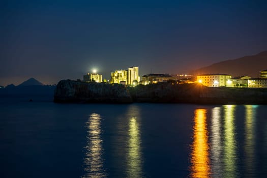 night view of View of the Church of Santa Maria de la Asuncion Castro Urdiales Santa Ana Castle.