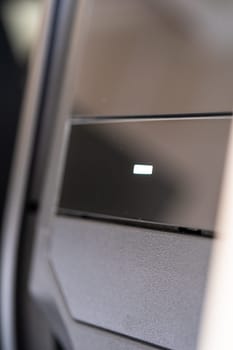 Denver, Colorado, USA-May 5, 2024-This image provides a close-up look at a car door opener, showcasing the clean lines and modern design typical of contemporary vehicle interiors. The focus on the mechanism highlights its sleek, minimalist style.