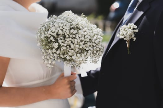 Bridal bouquet and a groom boutonniere of Gypsophila flowers