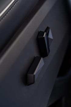 Denver, Colorado, USA-May 5, 2024-This image captures a close-up view of the seat adjustment buttons located in the Tesla Cybertruck, emphasizing the minimalist and sleek design of the vehicle interior controls.