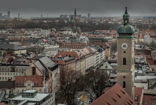 Munich, Germany - Dec 22, 2023 - Aerial view of Aerial view of Tower of St. Peter's Church and surrounding buildings. The Church of St. Peter, Downtown view, Space for text, Selective focus.