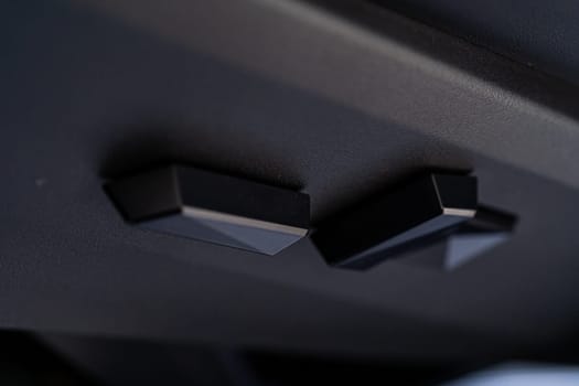 Denver, Colorado, USA-May 5, 2024-This image captures a close-up view of the seat adjustment buttons located in the Tesla Cybertruck, emphasizing the minimalist and sleek design of the vehicle interior controls.