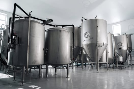 interior of a modern factory brewery with tanks inside
