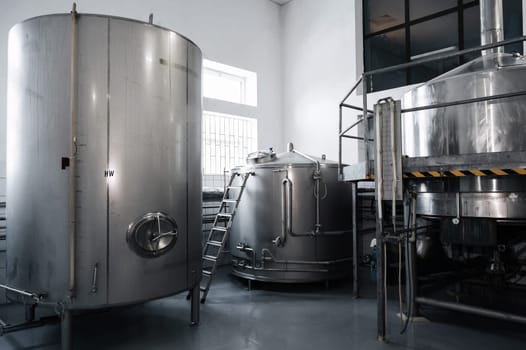 interior of a modern factory brewery with tanks inside