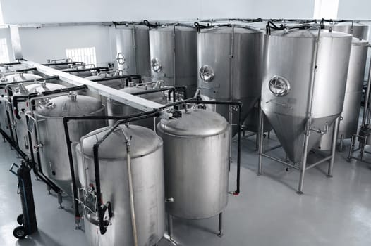interior of a modern factory brewery with tanks inside