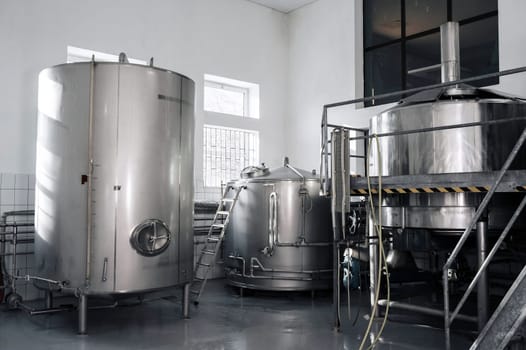 interior of a modern factory brewery with tanks inside