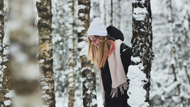 Portrait of a girl in winter in a birch forest