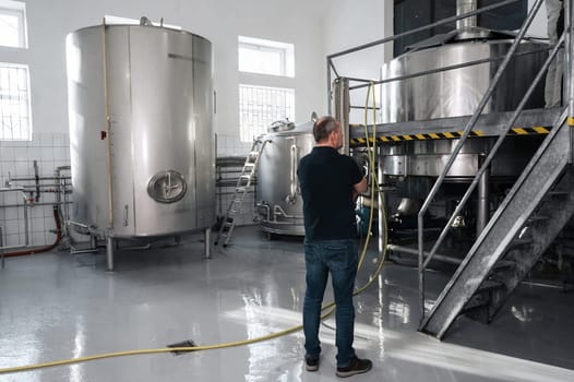 brewer at a modern brewery controls production
