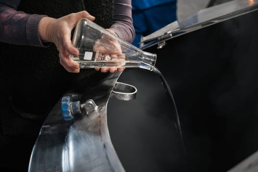 adding prepared water in the process of brewing beer in a tank at a beer production plant