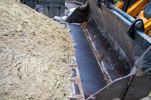 Big excavator bucket at the Construction site