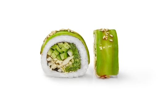 Vegetarian avocado sushi roll with light vegetable filling of hiyashi wakame, napa cabbage and cucumber drizzled with unagi sauce and sesame seeds, isolated on white background