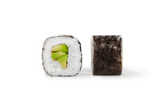 Closeup of light vegetarian maki rolls filled with ripe avocado wrapped in rice and nori seaweed, isolated on white background. Popular Japanese snack