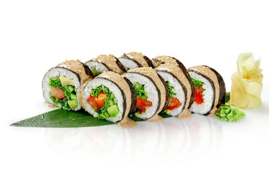 Appetizing Japanese style vegetarian sushi rolls with lettuce, bell pepper, cucumber, tomato, avocado and hiyashi wakame seasoned with piquant peanut sauce served on bamboo leaf with ginger and wasabi