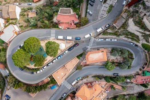 Aerial view from drone of curves of mountain road. Transportation and infrastructure concept