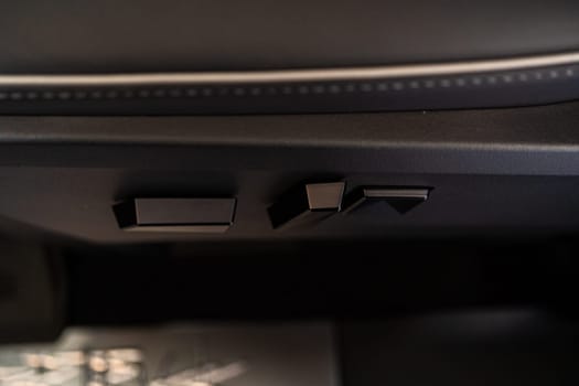 Denver, Colorado, USA-May 5, 2024-This image captures a close-up view of the seat adjustment buttons located in the Tesla Cybertruck, emphasizing the minimalist and sleek design of the vehicle interior controls.