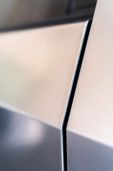 Denver, Colorado, USA-May 5, 2024-A close-up image capturing the precise panel seam of the Tesla Cybertruck, highlighting the minimalist design and sharp contours that characterize the exterior of this innovative electric vehicle.