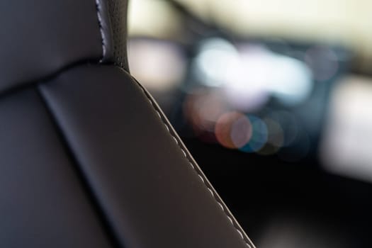 Denver, Colorado, USA-May 5, 2024-This image captures a detailed close-up view of the intricate stitching on a leather seat inside a Tesla Cybertruck, showcasing the high-quality materials and craftsmanship.