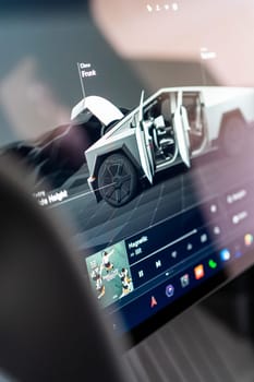 Denver, Colorado, USA-May 5, 2024-The interior of a Tesla Cybertruck showcasing its advanced touchscreen display, which is centrally located between the driver and passenger seats. This image highlights the modern design and technological features of the electric vehicle.