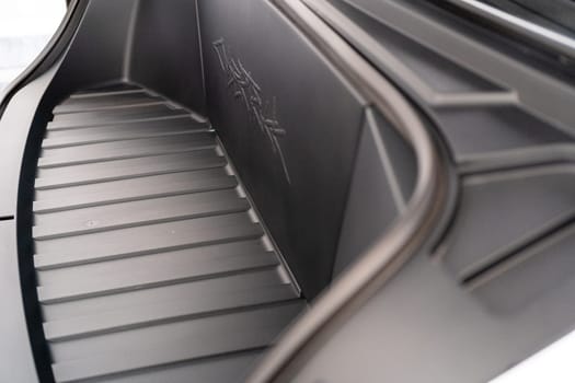 Denver, Colorado, USA-May 5, 2024-This image captures the intricate engraved Tesla logo located inside the open frunk of a Tesla Cybertruck, showcasing the attention to detail and sleek design elements characteristic of Tesla innovative electric vehicles.