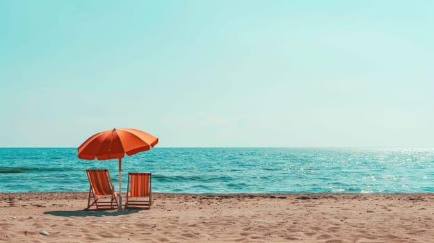A chair and an umbrella provide shade on the sandy beach, with the azure sky reflecting in the crystal clear water of the oceanic coastal landforms AIG50
